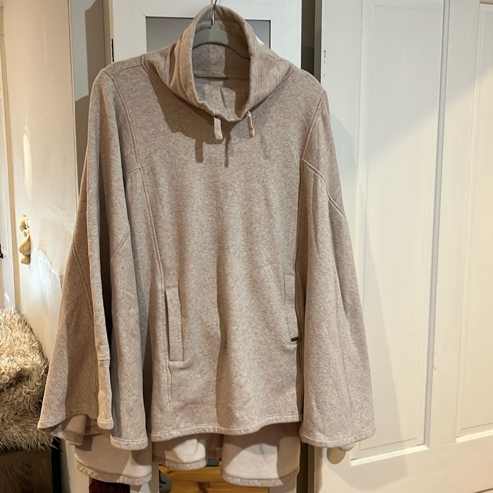 Ugg fleece lined poncho oatmeal color. Worn twice excellent condition size M/L
